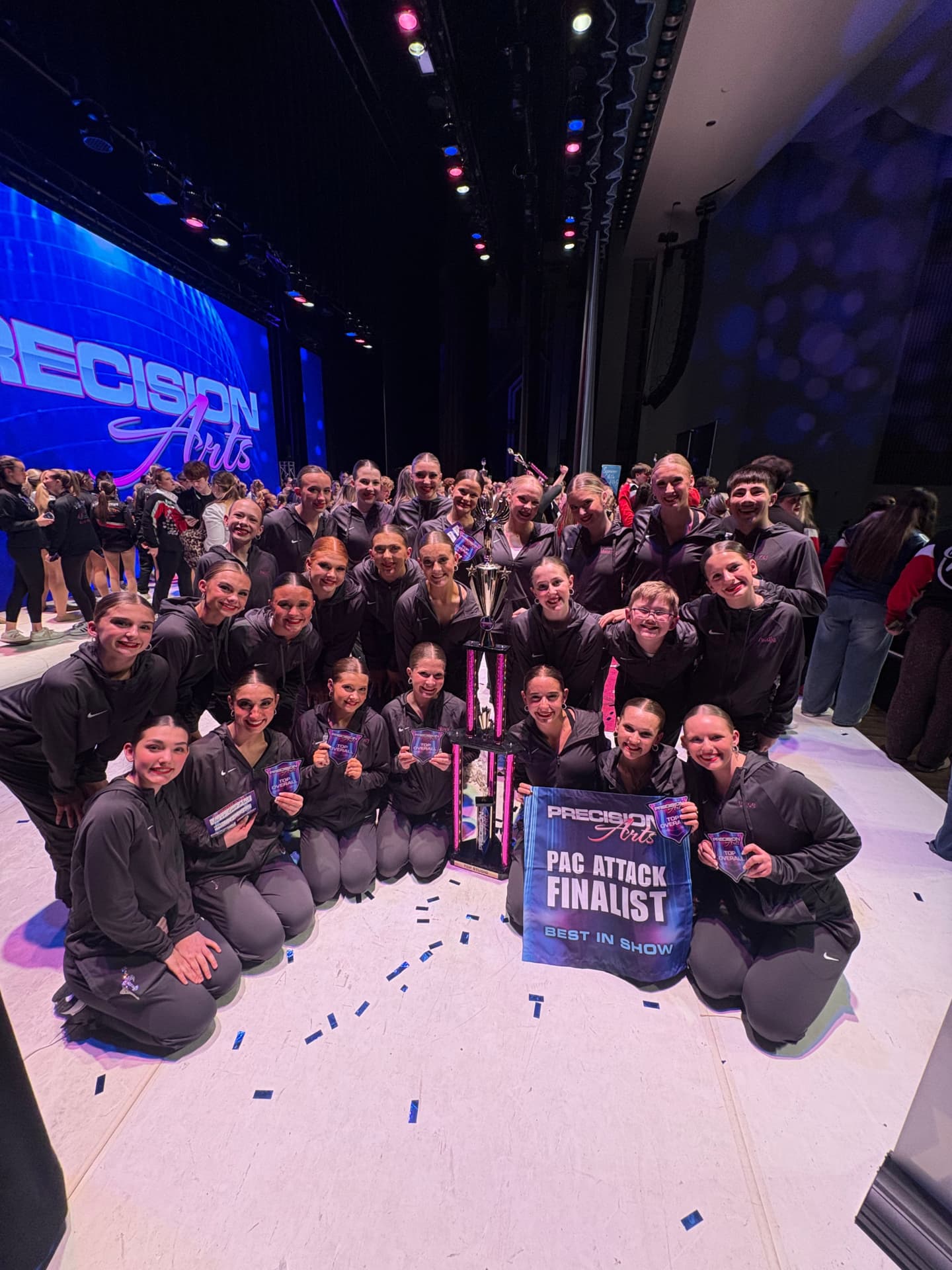 Next Level team celebrating as PAC Attack finalists with a trophy