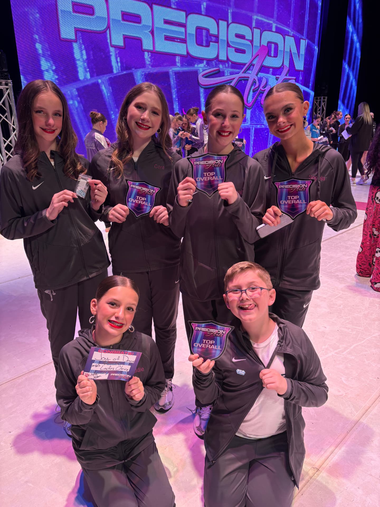 Next Level dancers holding Precision Arts top overall awards