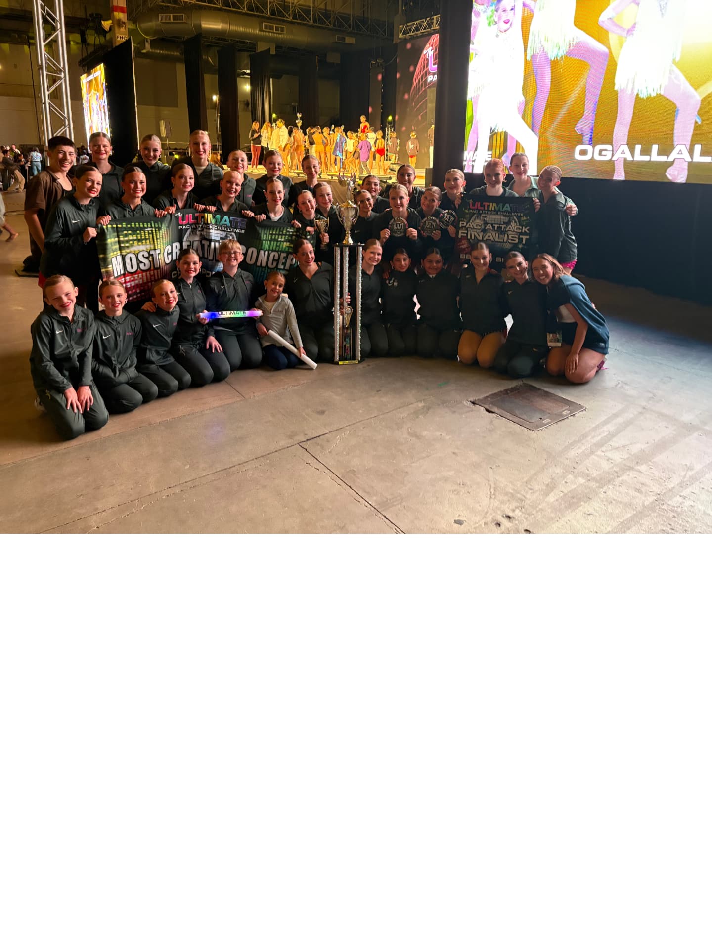 Next Level competition team with Most Creative Concept banner at nationals